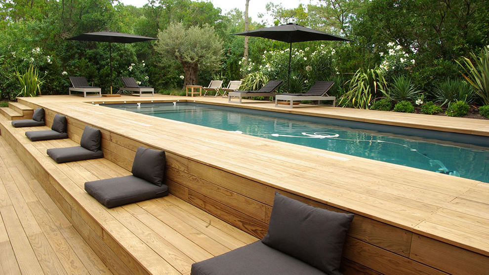 Photo of a large contemporary rectangular lap pool in Bordeaux with decking.