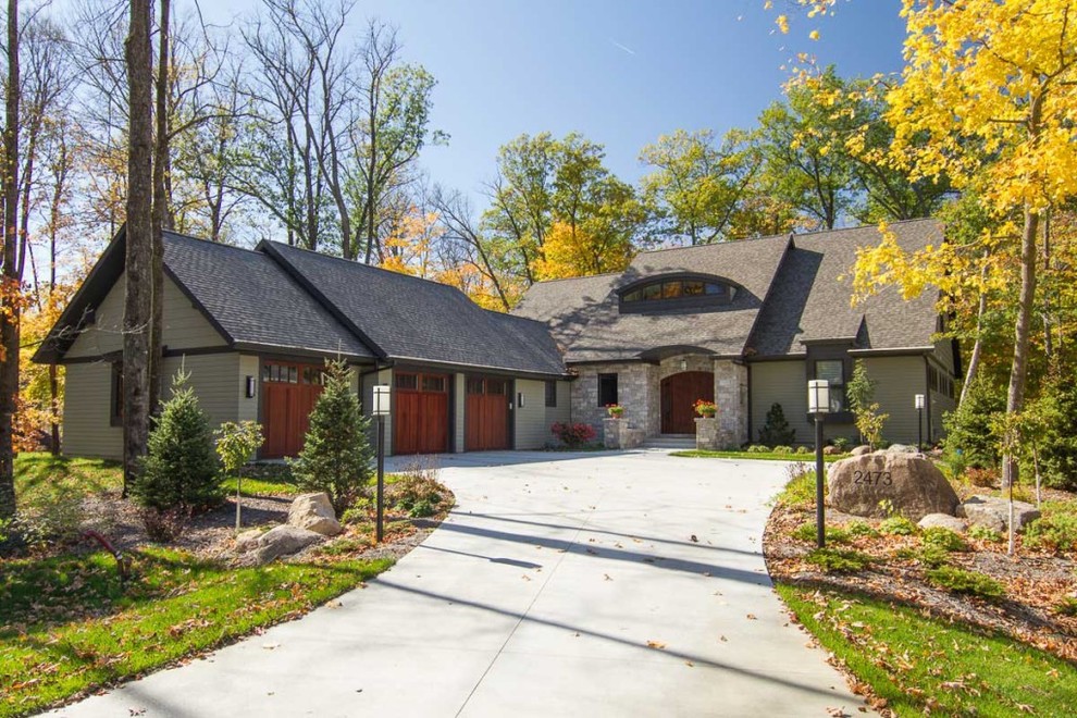 Design ideas for a mid-sized traditional two-storey grey exterior in Atlanta with mixed siding and a gable roof.