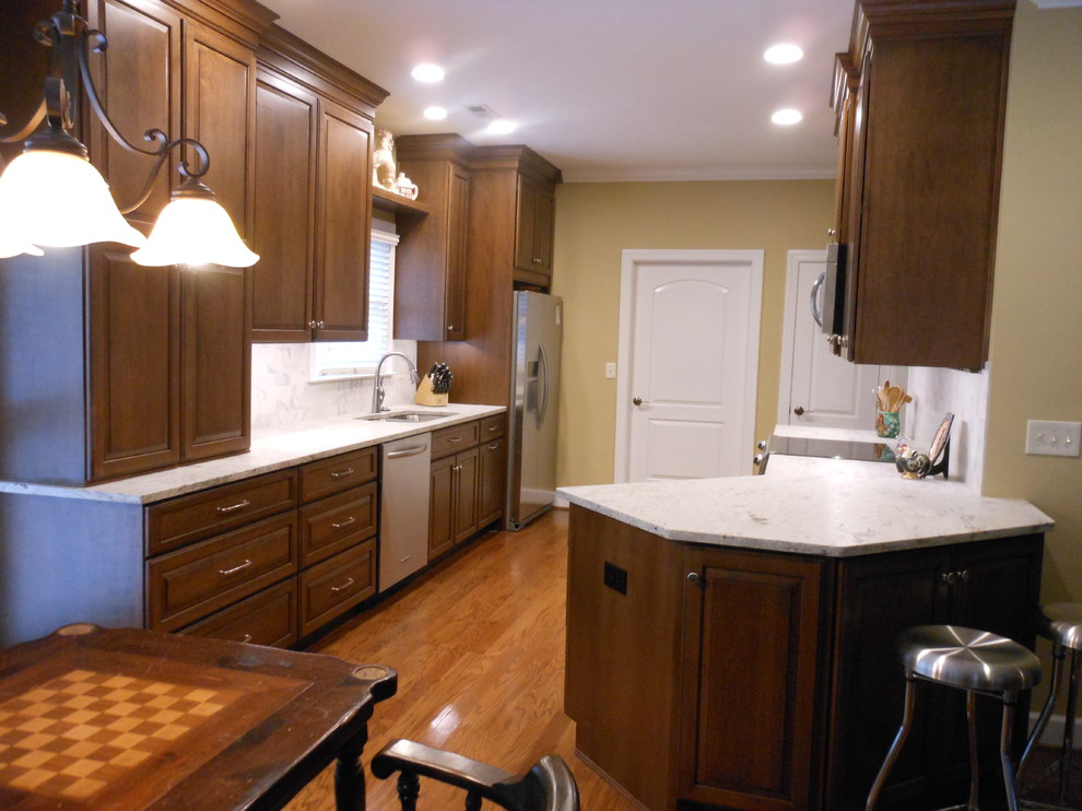 Open concept kitchen - mid-sized transitional galley open concept kitchen idea in Birmingham with an island