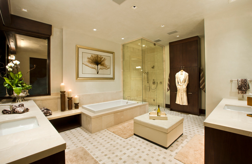 This is an example of a contemporary bathroom in Denver with a drop-in tub and a corner shower.