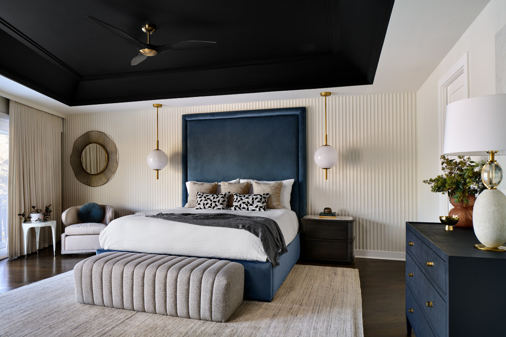 Example of a large transitional master dark wood floor, brown floor and tray ceiling bedroom design in Chicago with beige walls