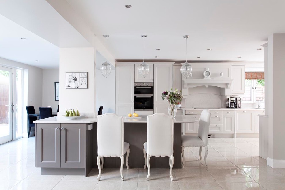 Large traditional u-shaped open plan kitchen in Other with an undermount sink, grey cabinets, quartzite benchtops, stone slab splashback, stainless steel appliances, porcelain floors, with island, white splashback, white floor and recessed-panel cabinets.