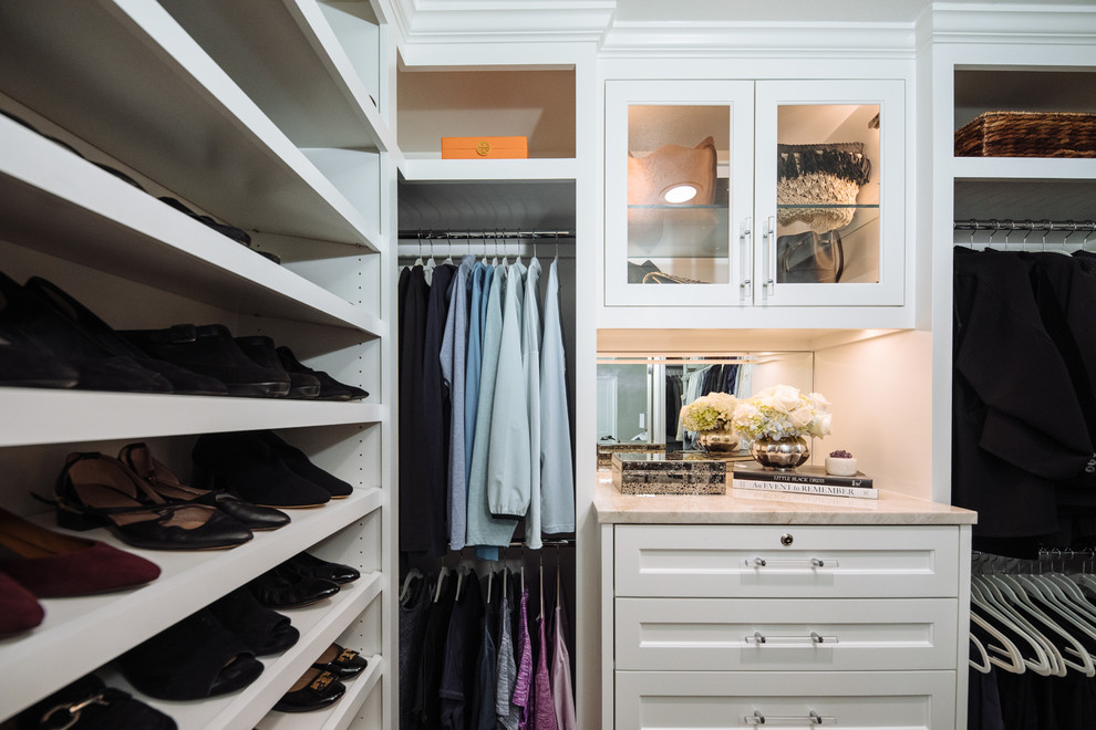 Design ideas for a small transitional women's walk-in wardrobe in Dallas with beaded inset cabinets, white cabinets, dark hardwood floors and brown floor.