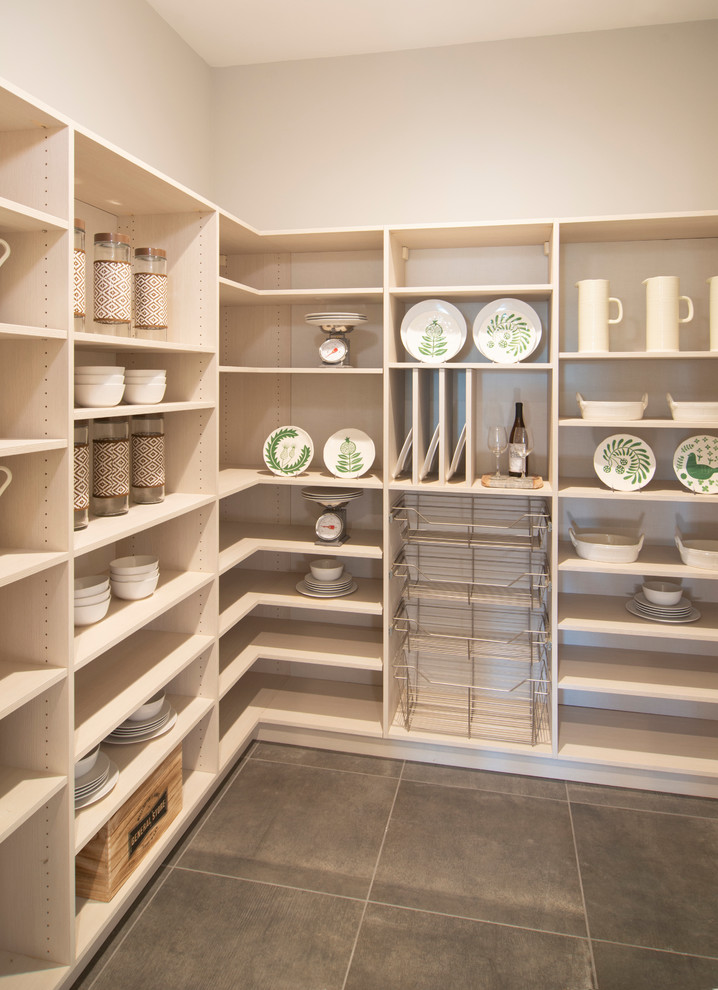 This is an example of a traditional l-shaped kitchen pantry in San Francisco with open cabinets and light wood cabinets.