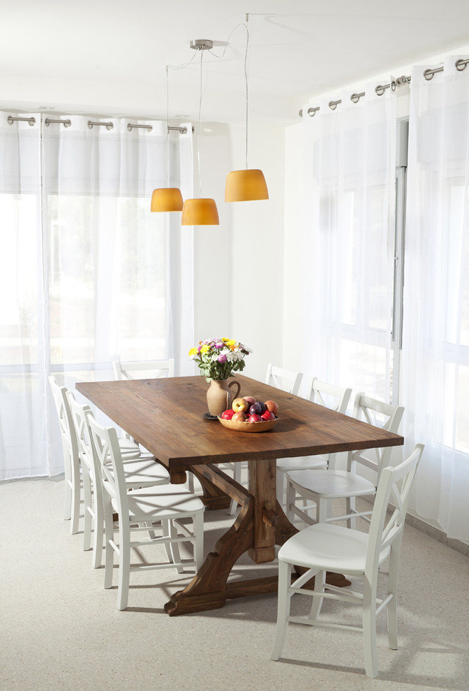 Design ideas for a country dining room in Tel Aviv with white walls.
