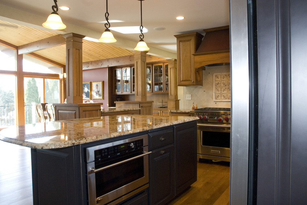 Design ideas for a traditional open plan kitchen in Minneapolis with stainless steel appliances and granite benchtops.