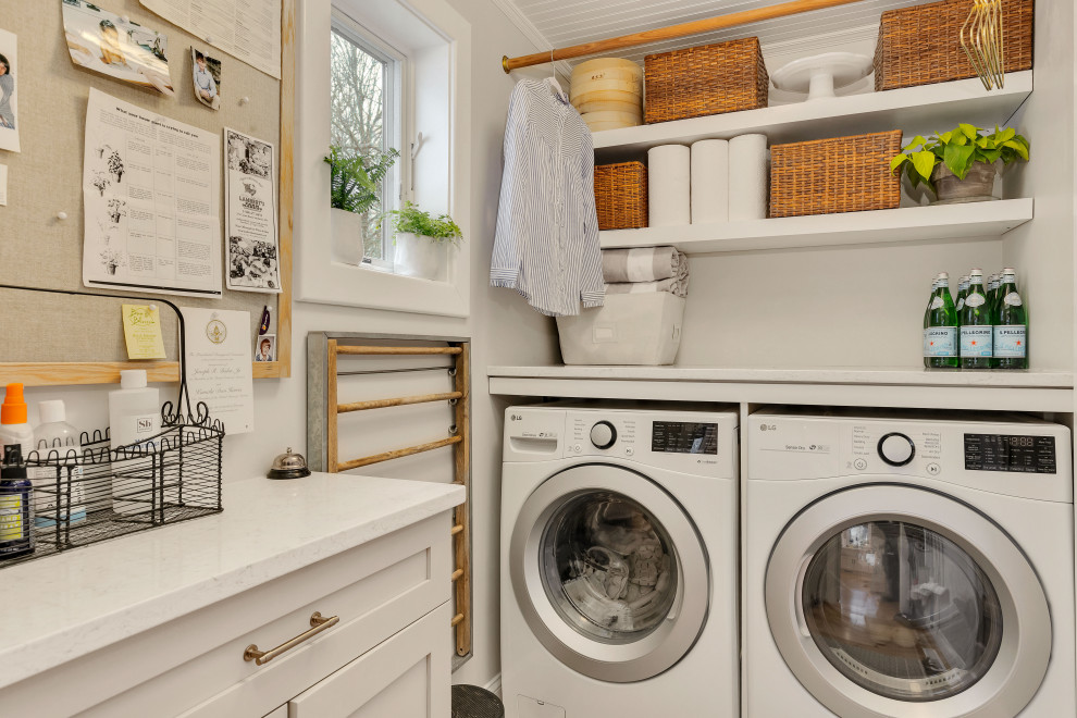 Example of a beach style laundry room design in Boston