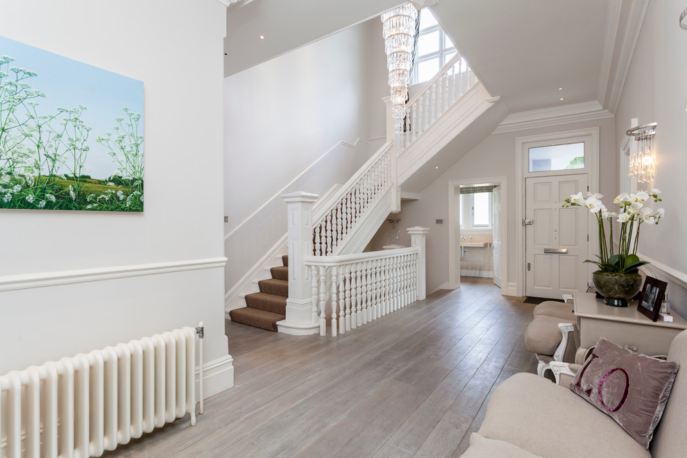 Inspiration for a traditional entryway in London with light hardwood floors.