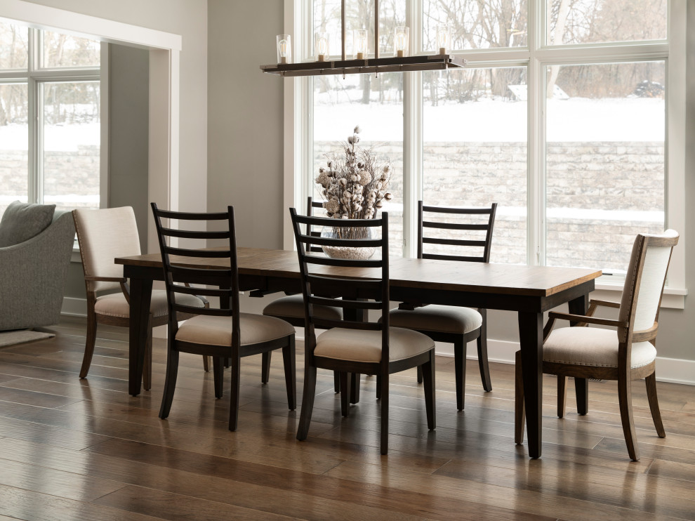 This is an example of a mid-sized transitional open plan dining in Milwaukee with grey walls, medium hardwood floors, no fireplace and brown floor.
