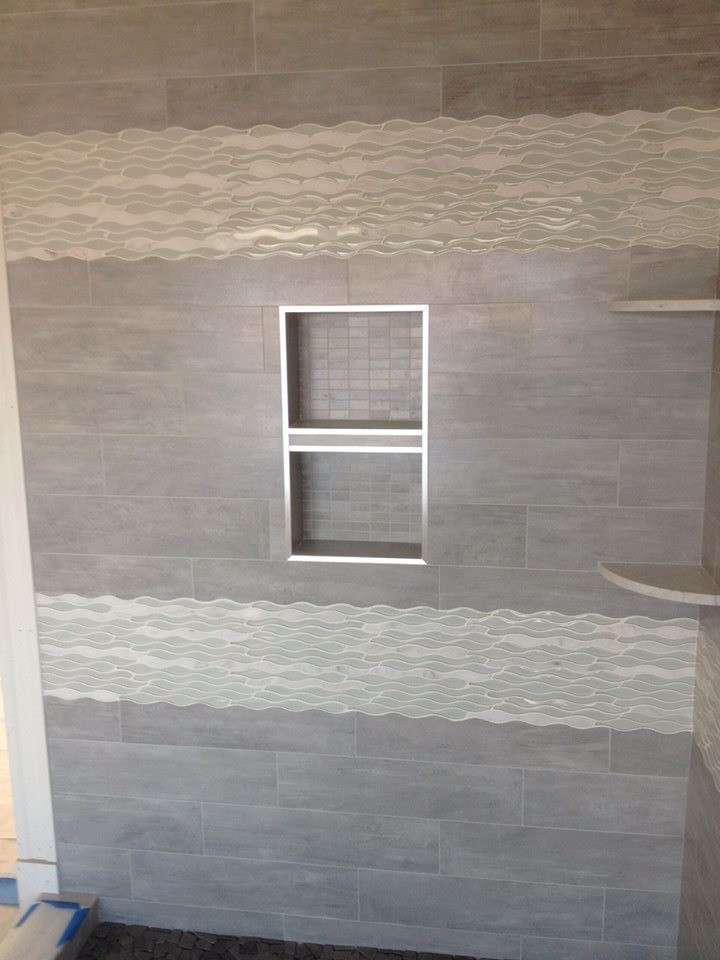 Doorless shower - transitional gray tile doorless shower idea in Boston with beige walls