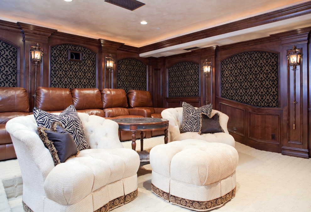 This is an example of a large mediterranean enclosed home theatre in San Diego with brown walls, carpet, a projector screen and white floor.