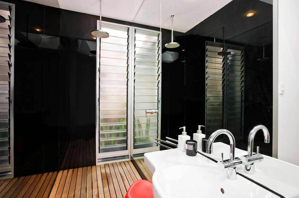 Mid-sized contemporary master bathroom in Sydney with an integrated sink, an open shower and glass sheet wall.