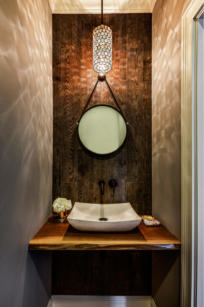 Inspiration for a transitional powder room in Chicago with a vessel sink.