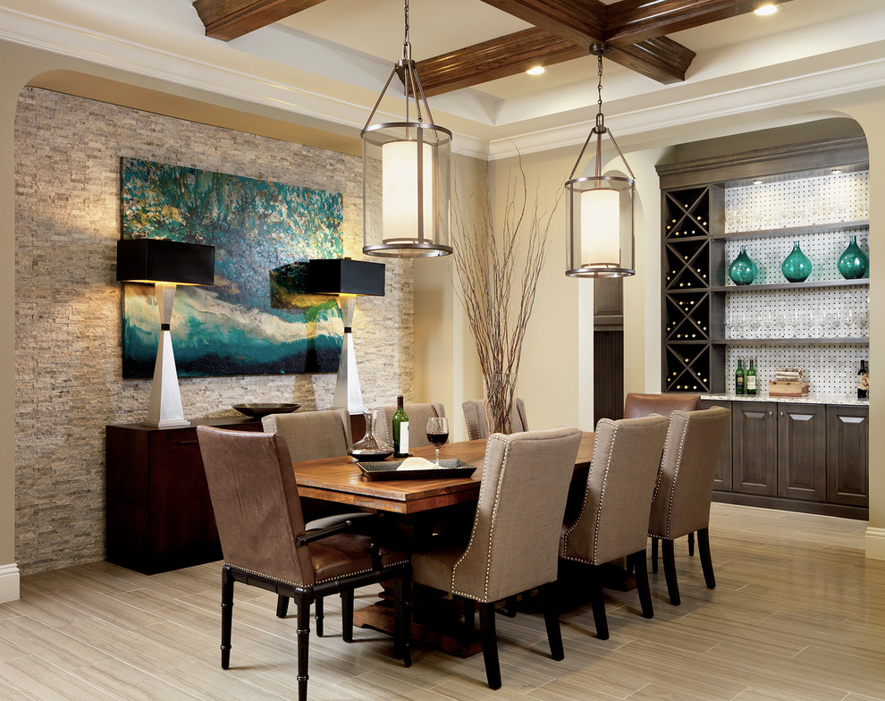 This is an example of a transitional dining room in Tampa with beige walls.