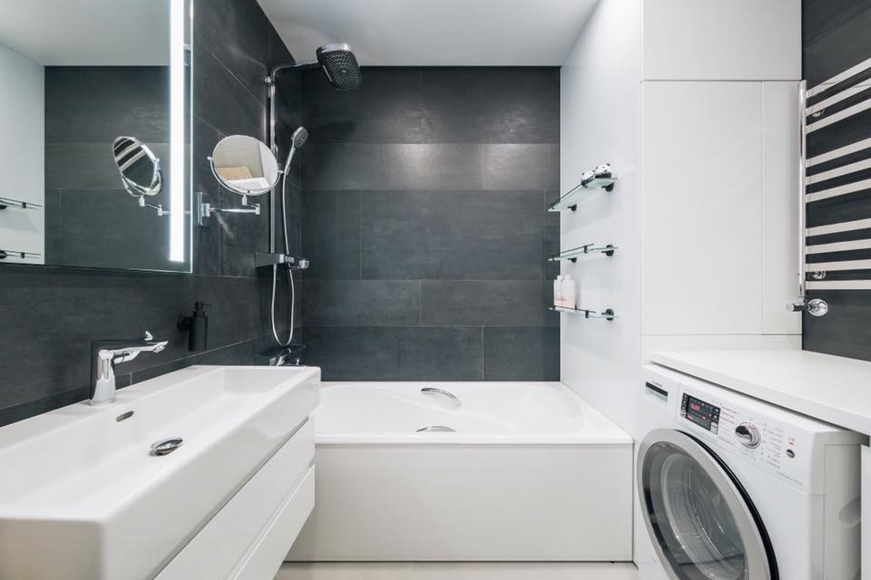 Small contemporary bathroom in Other with flat-panel cabinets, white cabinets, an alcove tub, a shower/bathtub combo, black tile, porcelain tile, black walls, porcelain floors, a drop-in sink, solid surface benchtops, white floor, an open shower and white benchtops.