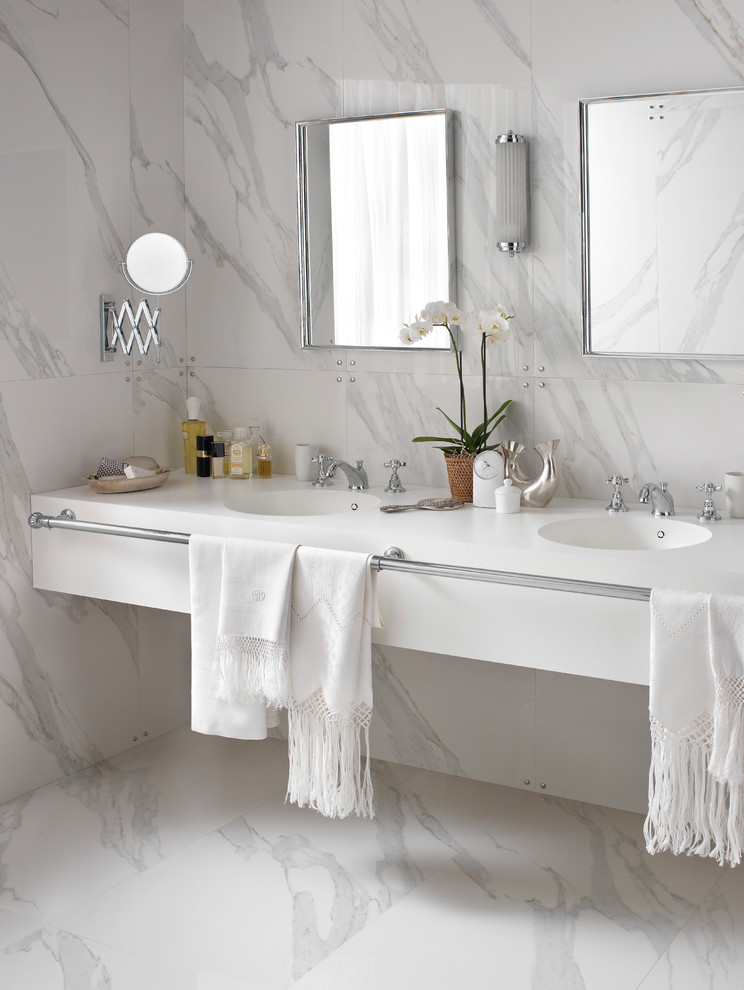 Design ideas for a modern master bathroom in Sydney with solid surface benchtops.