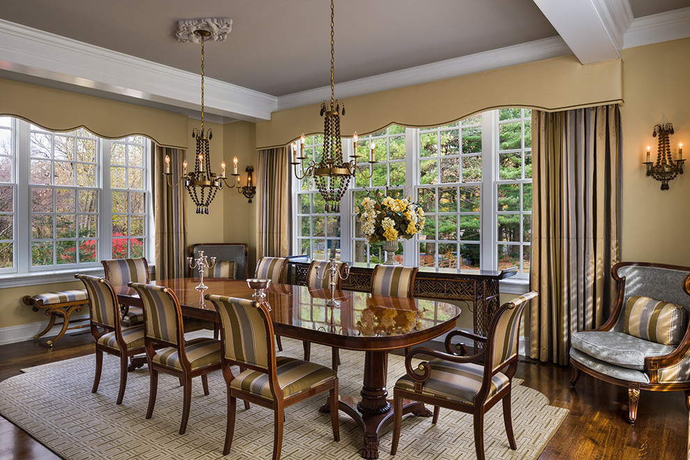 Traditional dining room in Philadelphia with beige walls and dark hardwood floors.