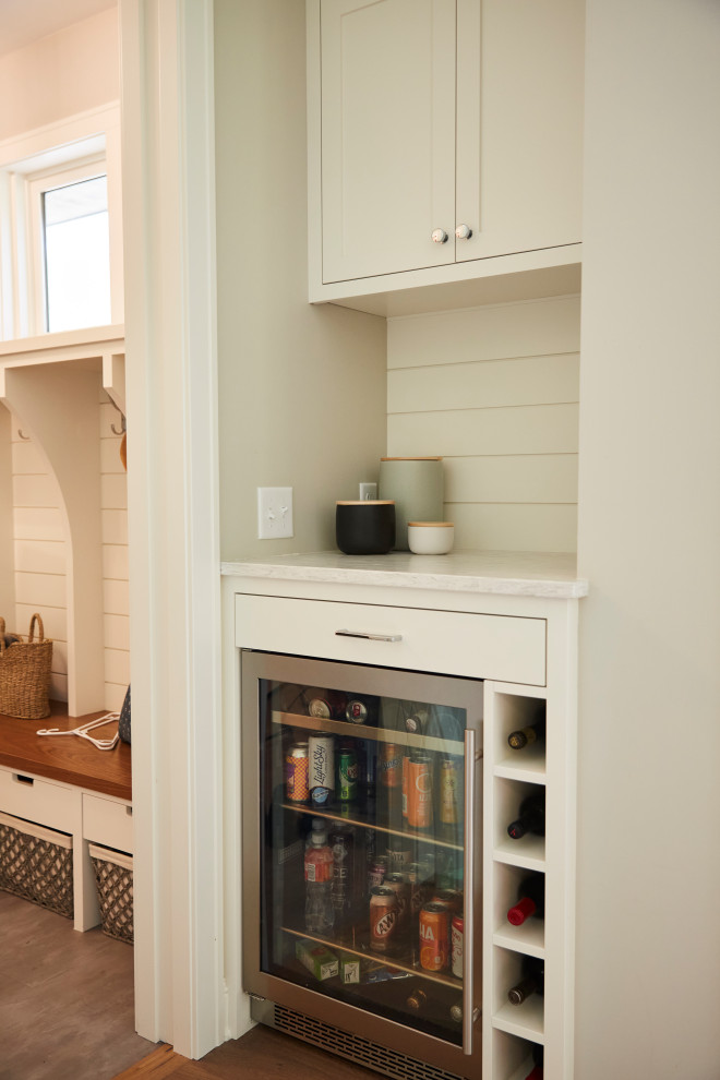 Example of a beach style home design design in Minneapolis