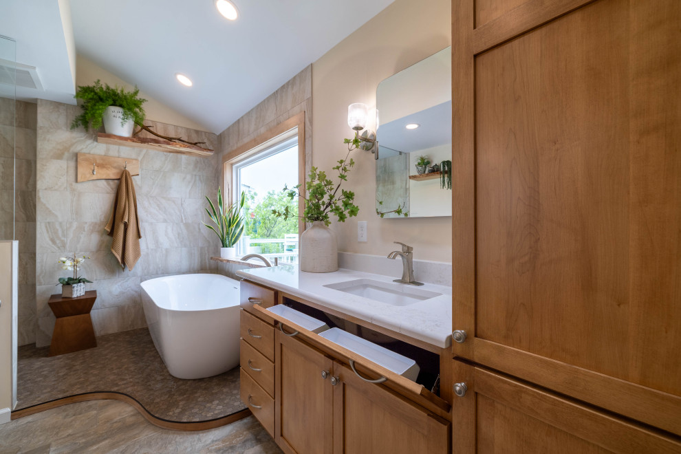 Arts and crafts master beige tile brown floor and single-sink bathroom photo in Other with light wood cabinets, a bidet, beige walls, an undermount sink, white countertops and a niche