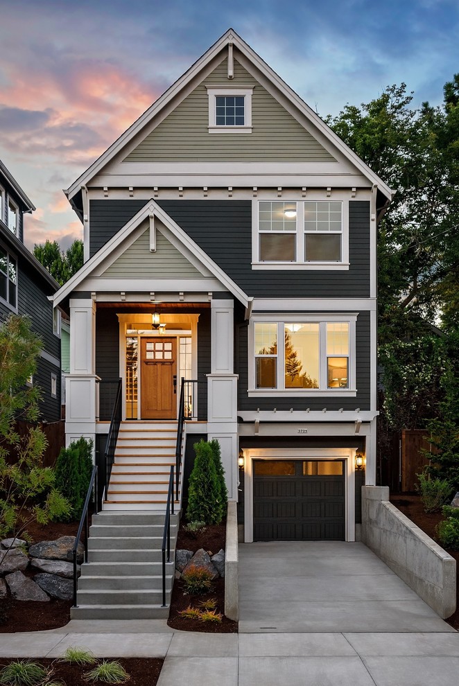 Traditional three-storey grey house exterior in Portland with a gable roof.