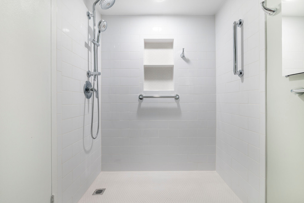 This is an example of a small classic ensuite bathroom in DC Metro with flat-panel cabinets, dark wood cabinets, a built-in bath, a walk-in shower, a one-piece toilet, white tiles, ceramic tiles, green walls, porcelain flooring, an integrated sink, solid surface worktops, beige floors, a shower curtain, white worktops, a wall niche, a single sink and a freestanding vanity unit.
