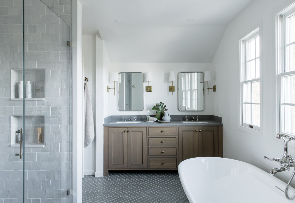 Photo of a medium sized classic ensuite bathroom in San Francisco with recessed-panel cabinets, medium wood cabinets, a freestanding bath, a double shower, a bidet, white tiles, porcelain tiles, white walls, cement flooring, a built-in sink, grey floors, a hinged door, grey worktops, an enclosed toilet, double sinks, a built in vanity unit and a vaulted ceiling.