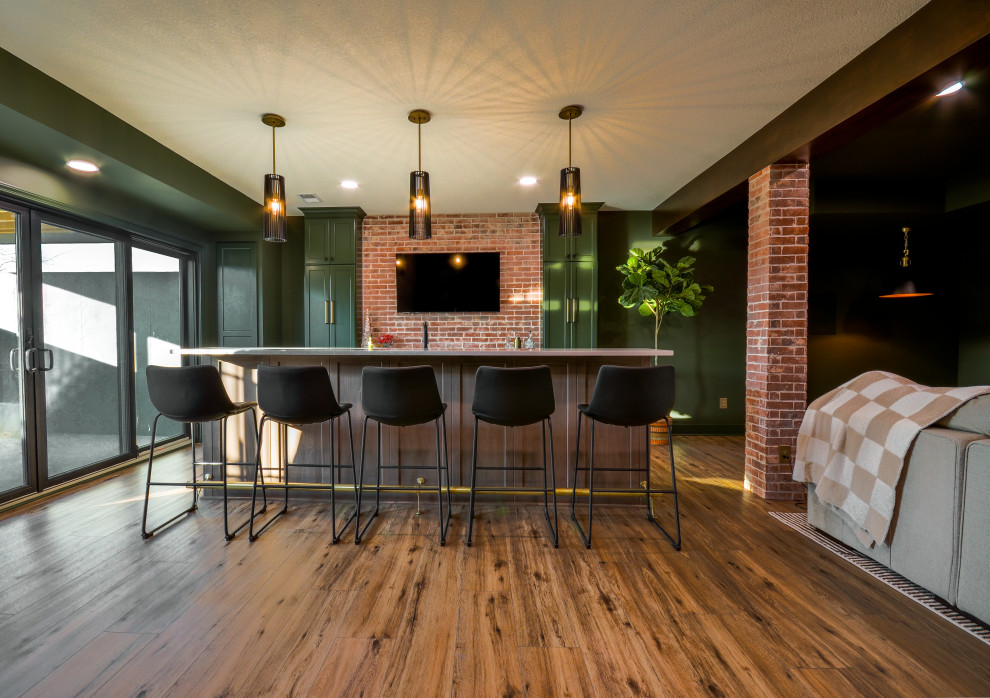 Inspiration for a large modern walk-out vinyl floor, exposed beam and brick wall basement remodel in Kansas City with a bar and green walls