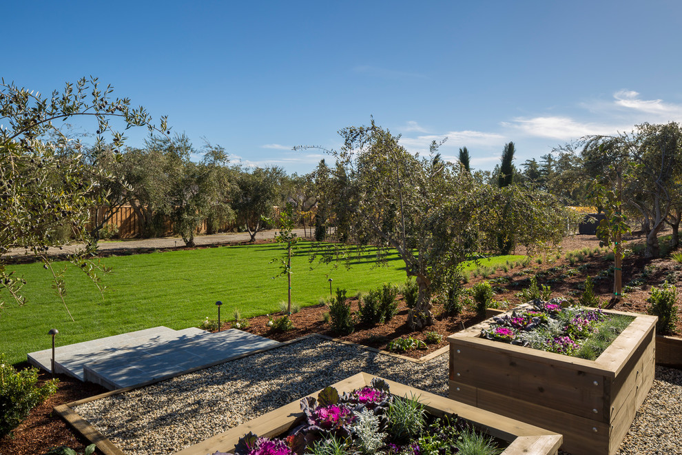 This is an example of an expansive country side yard full sun formal garden in San Francisco with a vegetable garden and gravel.