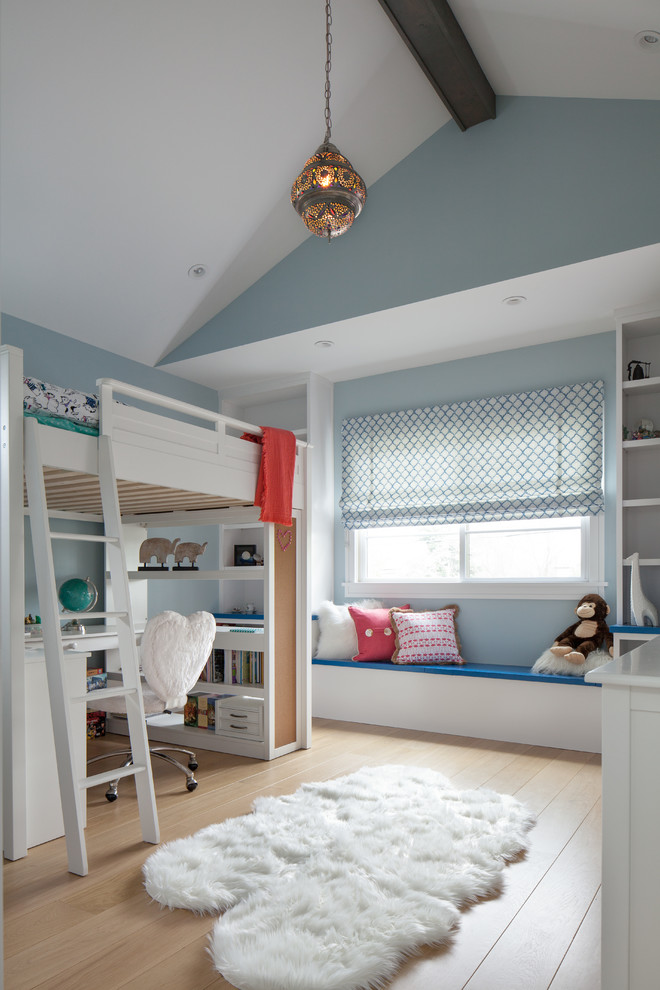Transitional Kids - Inspiration for a bedroom transitional gender-neutral medium tone wood floor and brown floor kids' bedroom remodel in San Francisco with blue walls