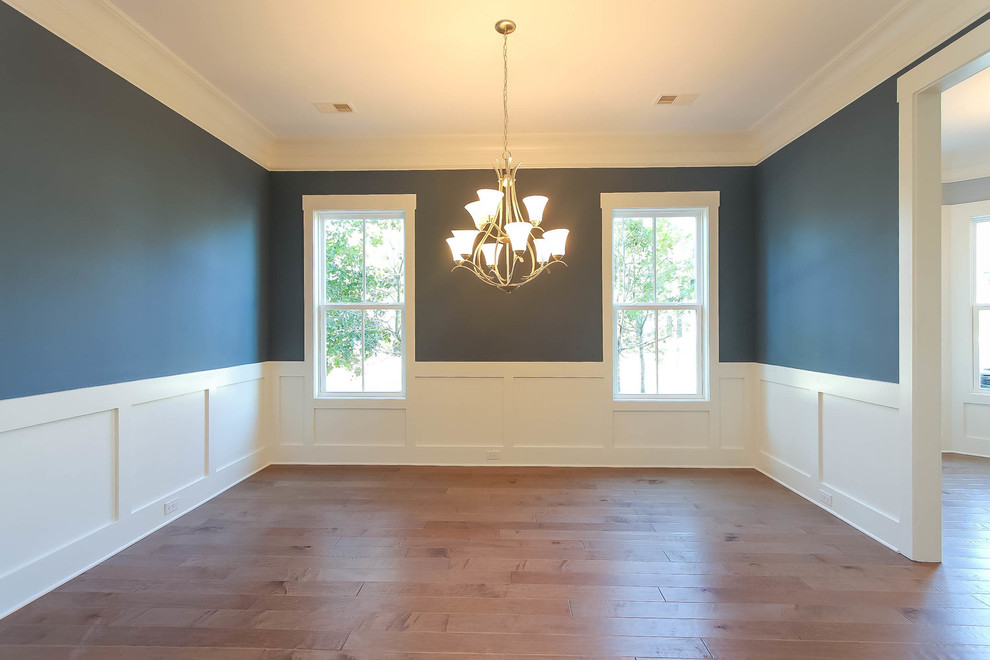Mid-sized transitional dining room in Charleston with blue walls and medium hardwood floors.
