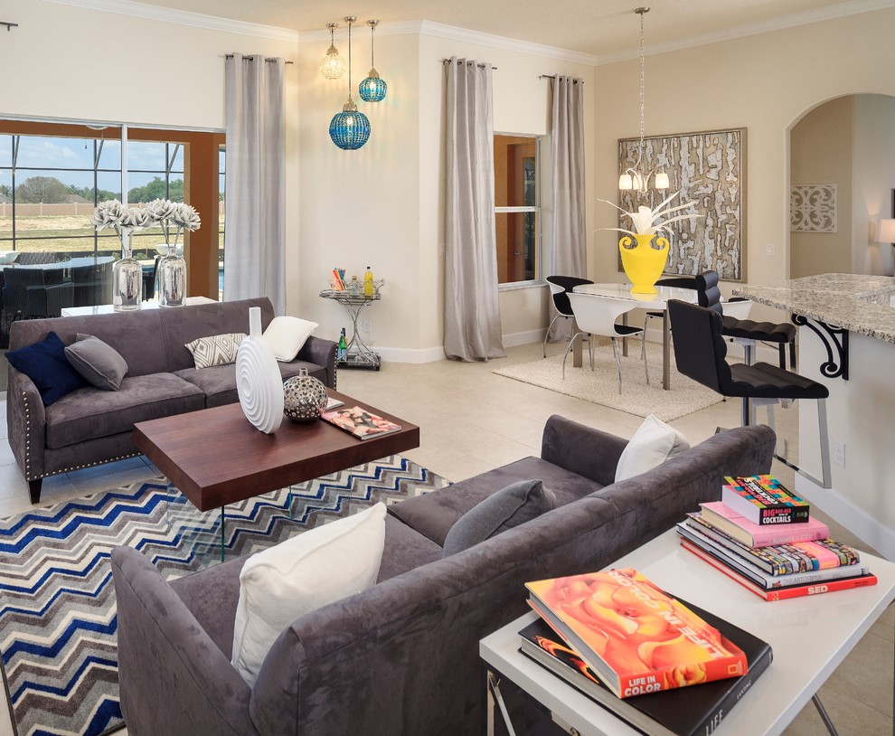This is an example of a contemporary open concept living room in Orlando with beige walls.