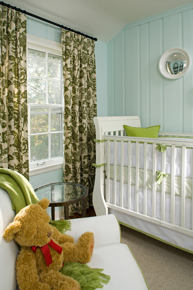 Traditional gender-neutral nursery in Minneapolis with blue walls and carpet.