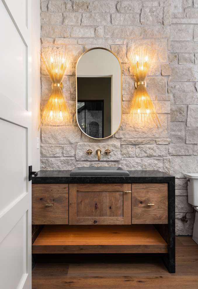 Design ideas for a modern cloakroom in Other with flat-panel cabinets, dark wood cabinets, stone slabs, white walls, dark hardwood flooring, black worktops and a built in vanity unit.