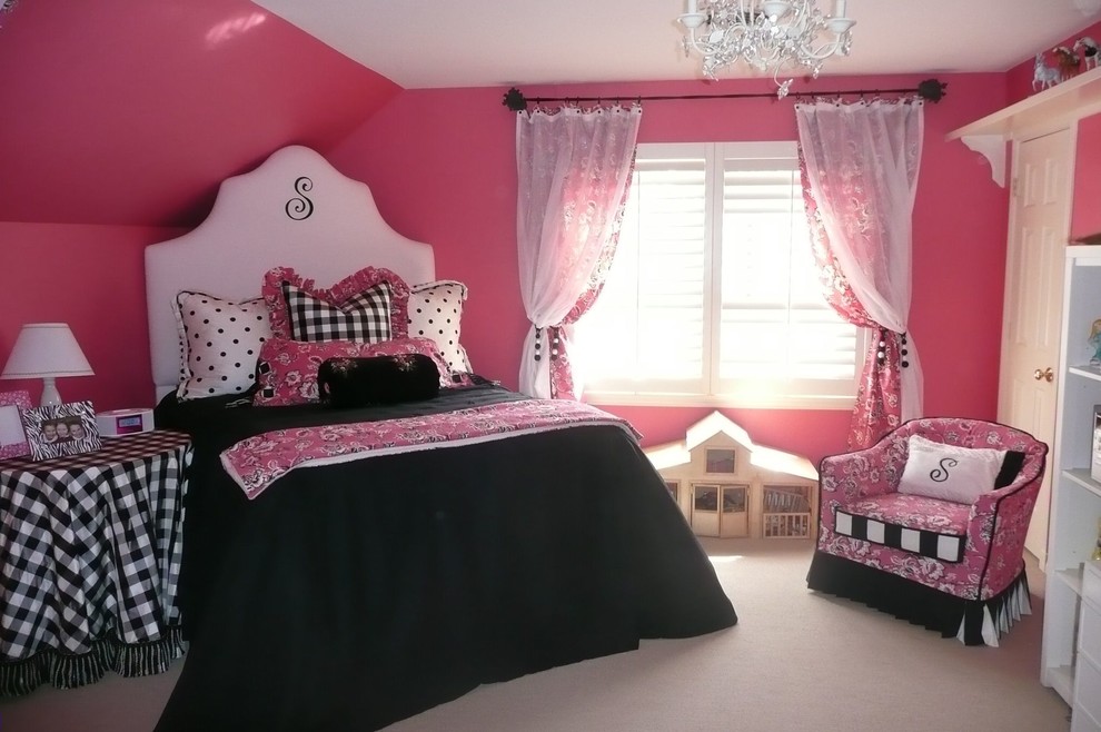 This is an example of a mid-sized traditional kids' bedroom for girls and kids 4-10 years old in Austin with pink walls, carpet and grey floor.