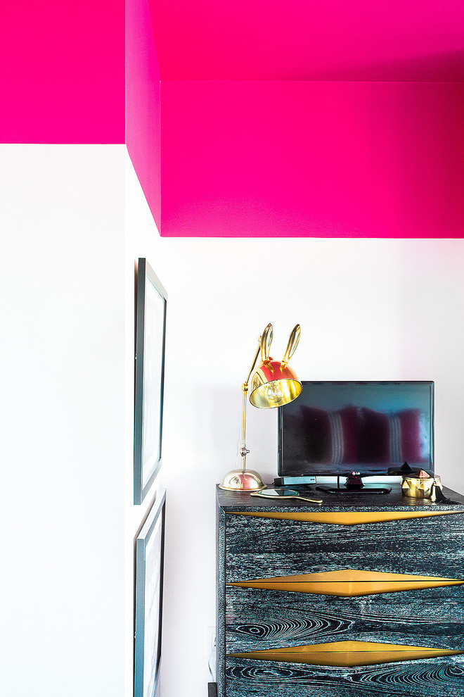 Penthouse Decor in Bethesda - Example of a bedroom and mid-sized trendy girl dark wood floor and black floor kids' bedroom design in DC Metro with pink walls