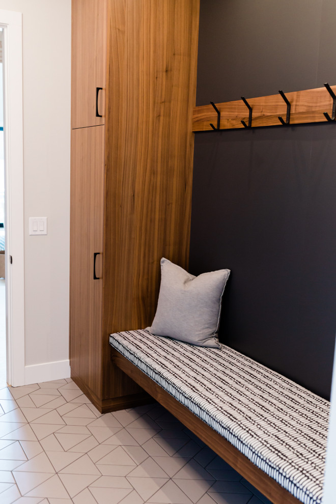 Mudroom - large modern porcelain tile and gray floor mudroom idea in Phoenix with gray walls
