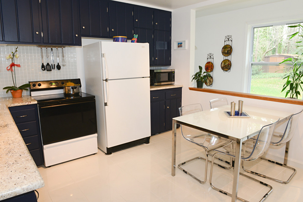 Contemporary l-shaped eat-in kitchen in Other with an undermount sink, beaded inset cabinets, blue cabinets, granite benchtops, white splashback, glass tile splashback and white appliances.