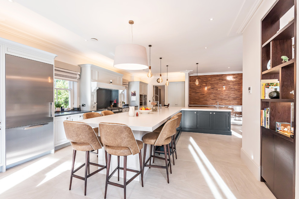 Photo of a large traditional l-shaped open plan kitchen in Berkshire with shaker cabinets, grey cabinets, quartzite benchtops, blue splashback, marble splashback, marble floors, with island, beige floor and white benchtop.