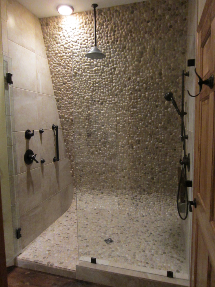 Photo of a large country master bathroom in Other with a vessel sink, an open shower, beige tile, pebble tile and pebble tile floors.