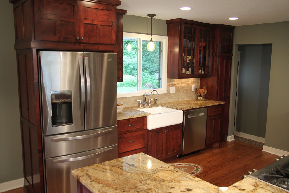Inspiration for a rustic kitchen remodel in Minneapolis with a farmhouse sink, flat-panel cabinets and medium tone wood cabinets