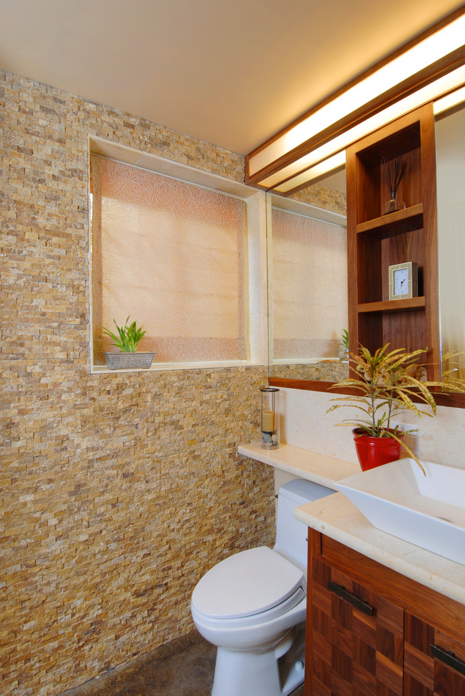 This is an example of a contemporary bathroom in San Francisco with a vessel sink and limestone.