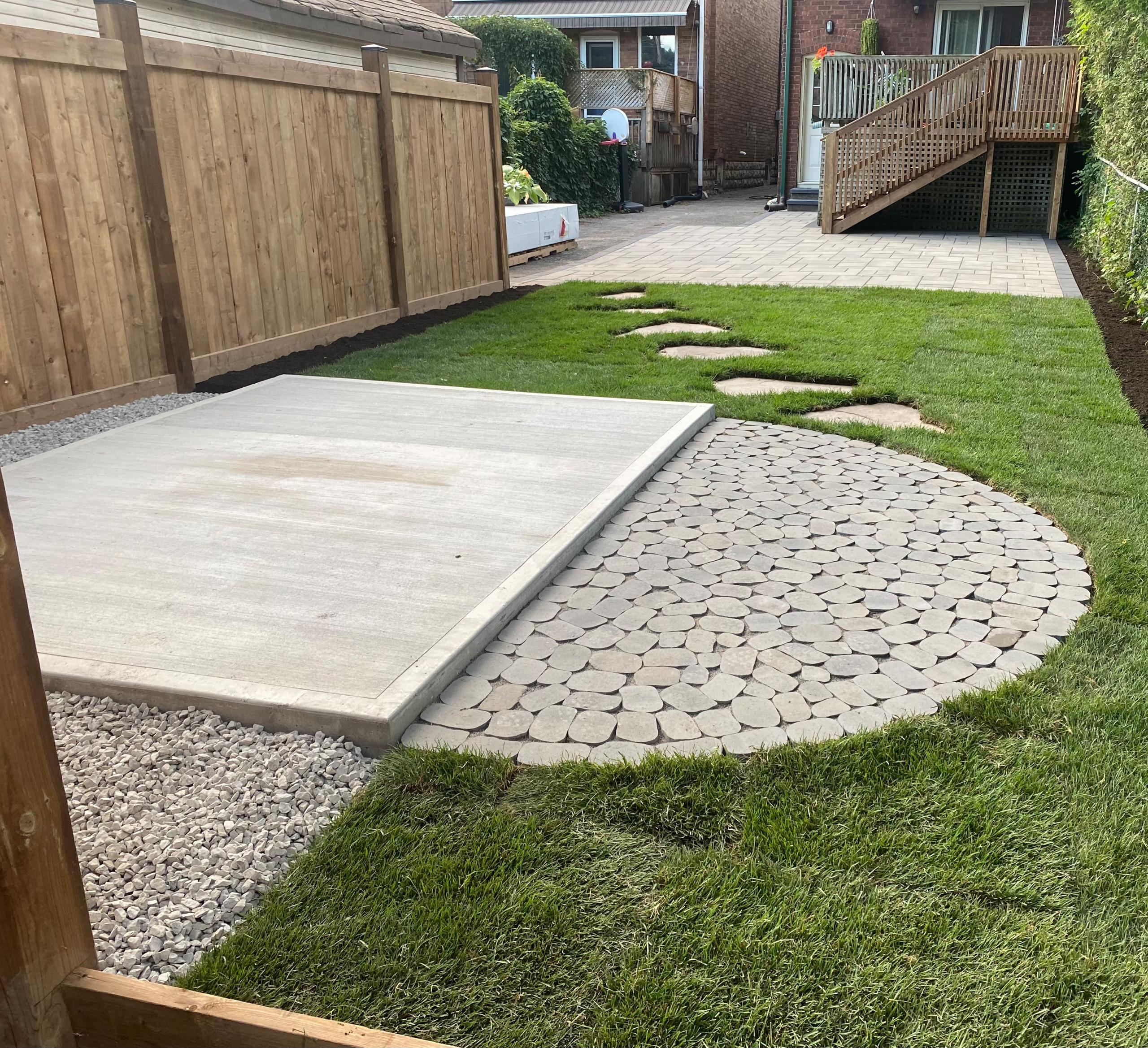 Cobble stone with stepping stones into Patio space