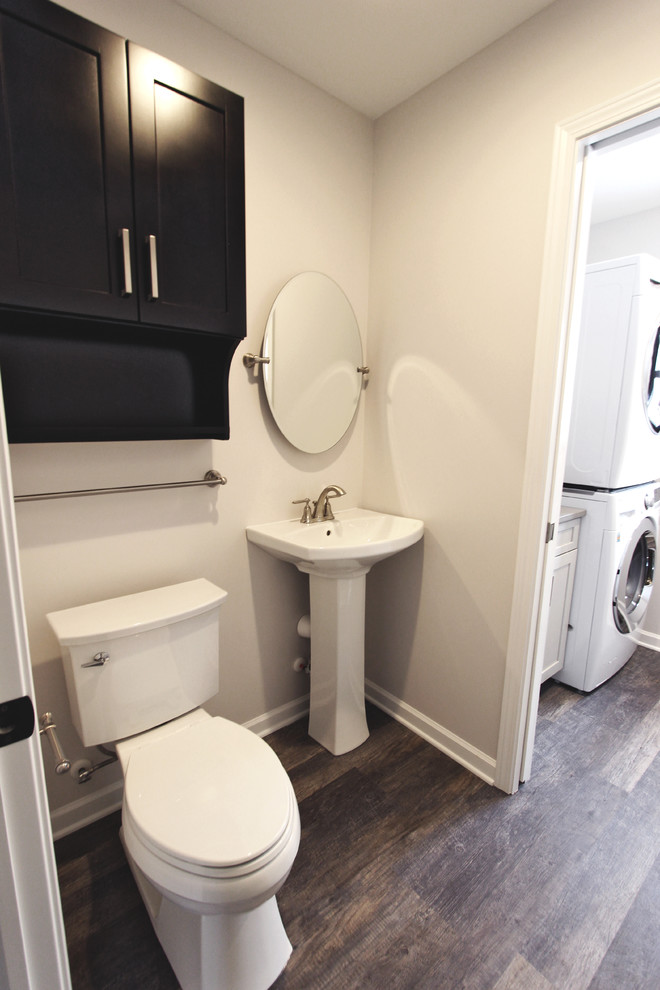 This is an example of a small transitional 3/4 bathroom in Cleveland with flat-panel cabinets and dark wood cabinets.