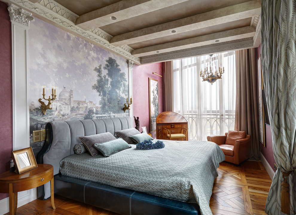 Photo of a traditional master bedroom in Moscow with pink walls and medium hardwood floors.