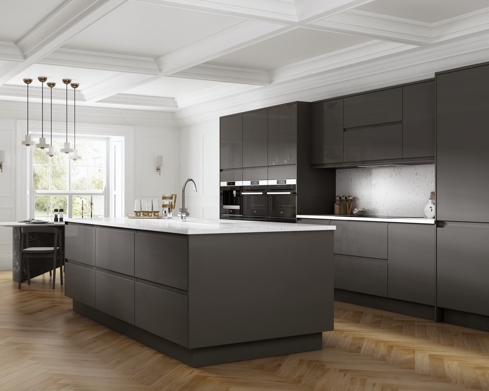 This is an example of a large contemporary single-wall kitchen/diner with a double-bowl sink, flat-panel cabinets, grey cabinets, quartz worktops, white splashback, integrated appliances, medium hardwood flooring, an island and brown floors.