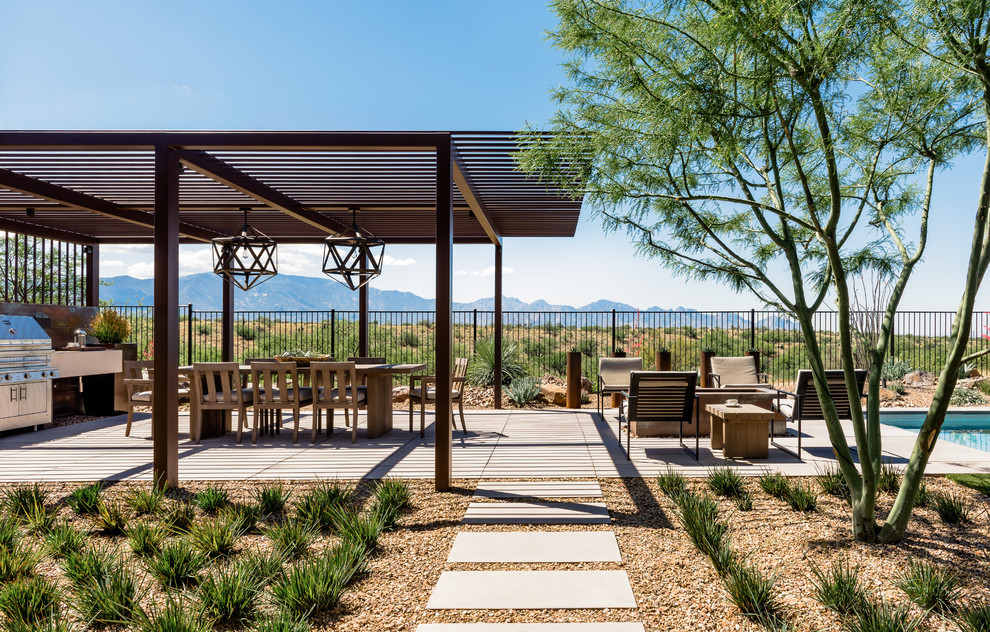 Design ideas for a contemporary backyard patio in Phoenix with concrete pavers.