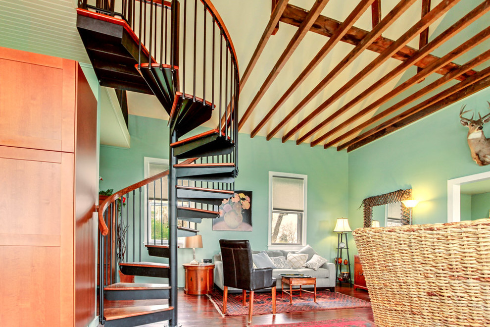 Inspiration for a mid-sized eclectic wood spiral staircase in Chicago with metal risers and mixed railing.