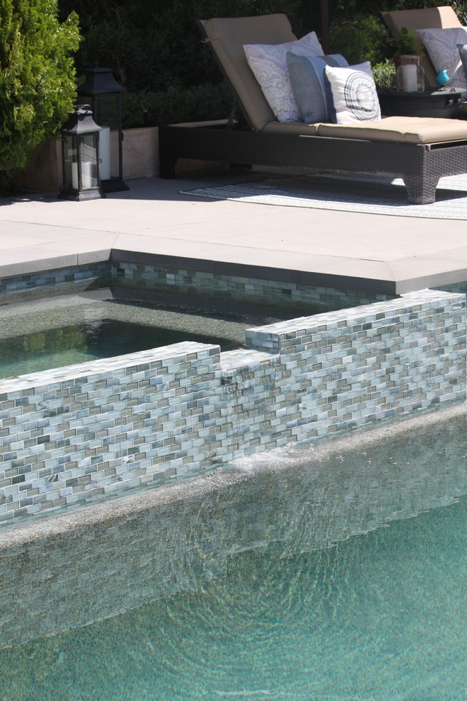 Pool - large transitional backyard concrete and rectangular pool idea in Los Angeles