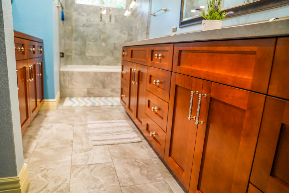 Design ideas for a mid-sized contemporary master bathroom in Orange County with a drop-in tub, a shower/bathtub combo, porcelain floors, a drop-in sink, marble benchtops, grey floor, an open shower, beige benchtops, a double vanity and a built-in vanity.