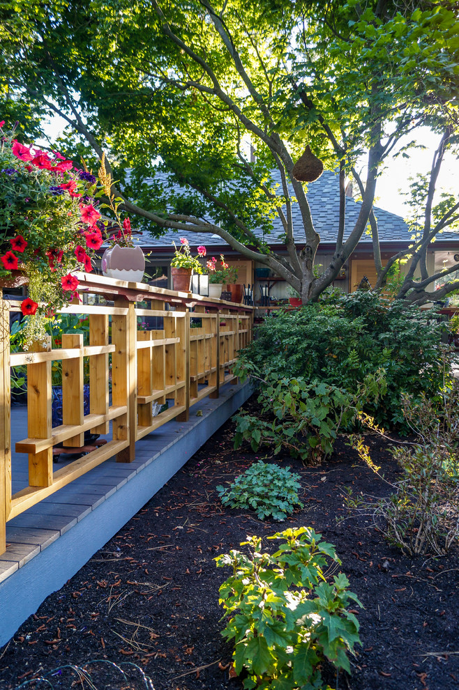 Inspiration for a mid-sized asian backyard deck in Other with a container garden and no cover.